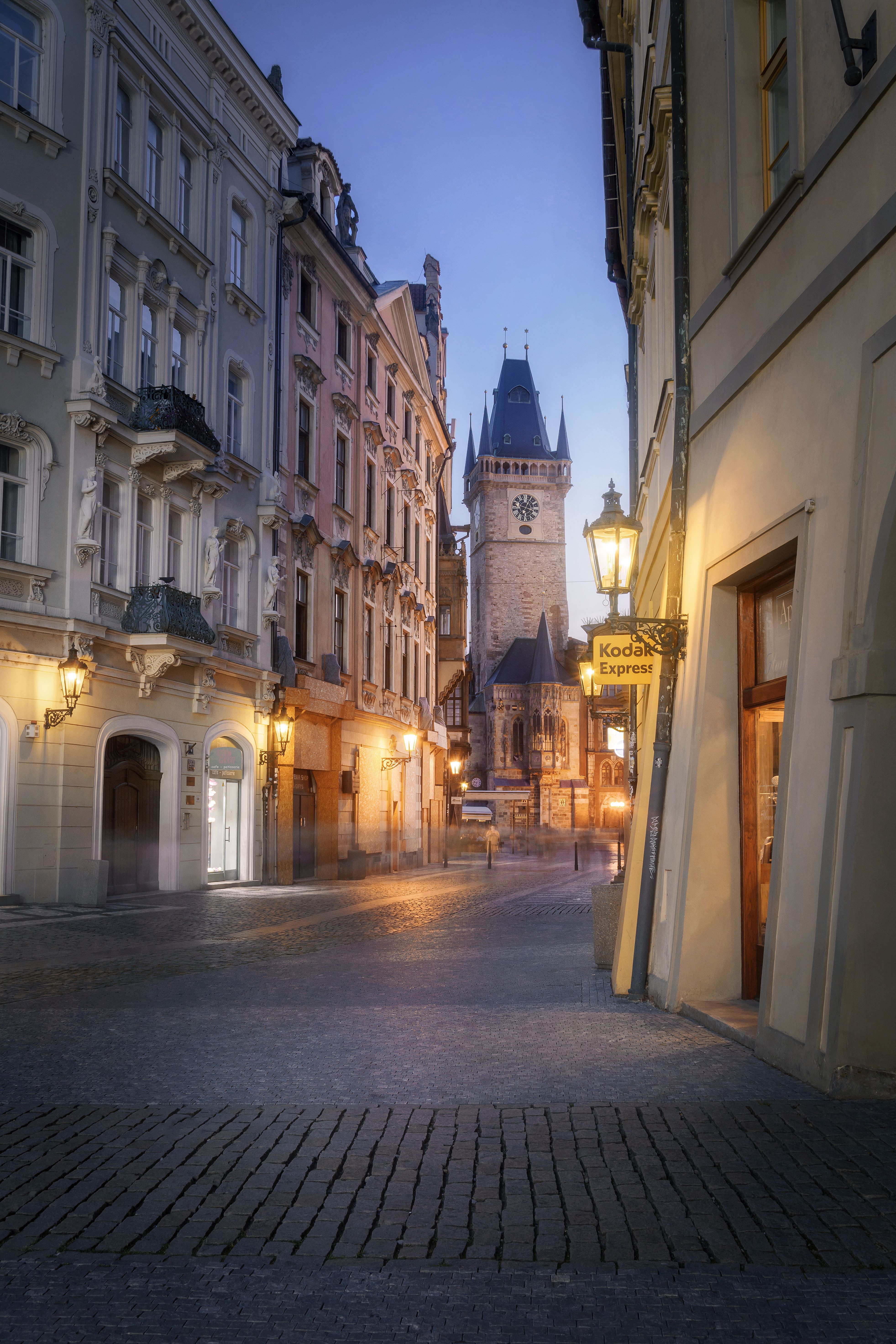 Twilight scene of a cobblestone street with historic architecture in Prague's old town