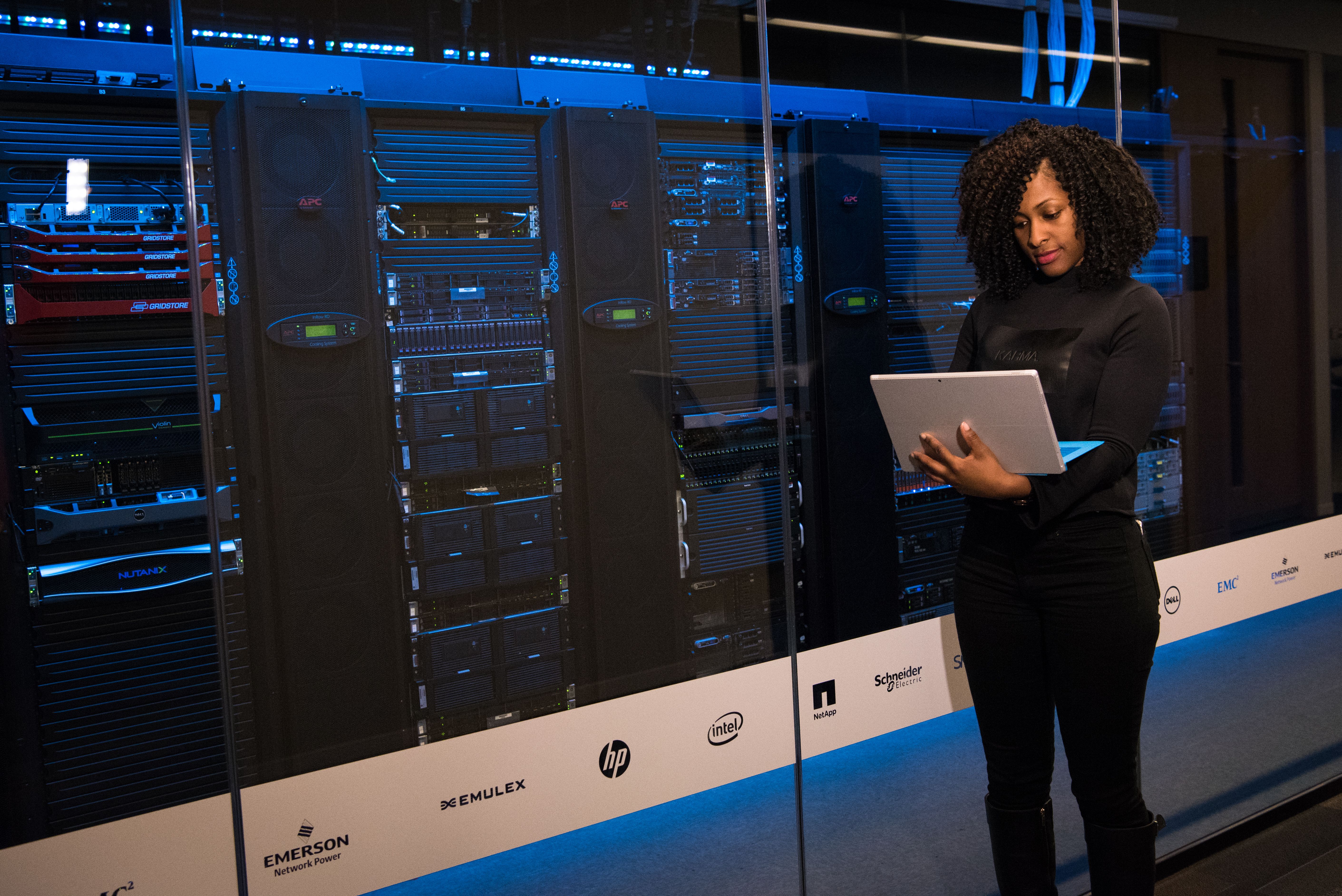 IT engineer monitoring servers in a data center managing global infrastructure access